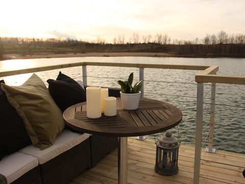 The terrace at SPABoot on Lake Störmthal by twilight