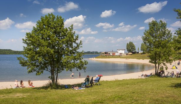 A summer day on the beach at Lake Schladitz. 