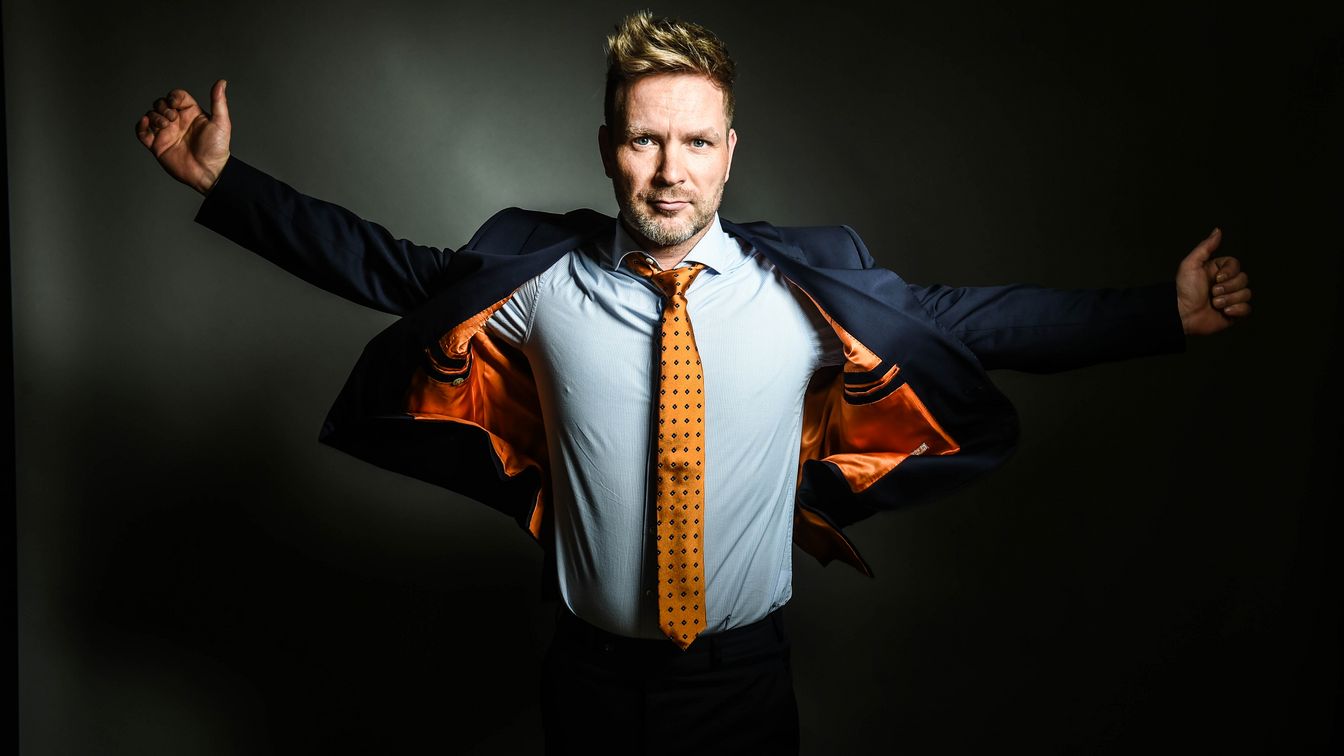 A man wears a tailor-made suit by Wagler-Couture.