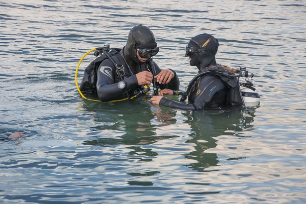 Two divers preparing to dive at Lake Schladitz.