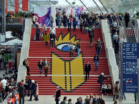 Staircase with the logo of the Leipzig Book Fair and many visitors