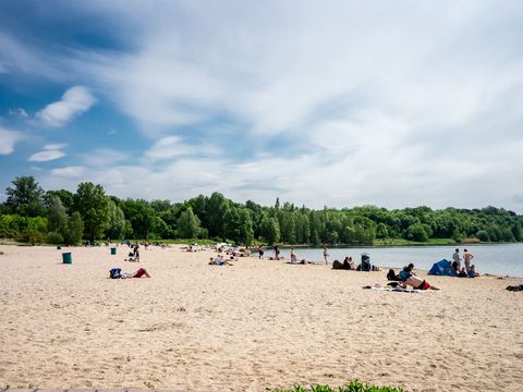 A sandy beach at Lake Cospuden in Markkleeberg. Recreation, relaxation, action and fun in the water at the lake.